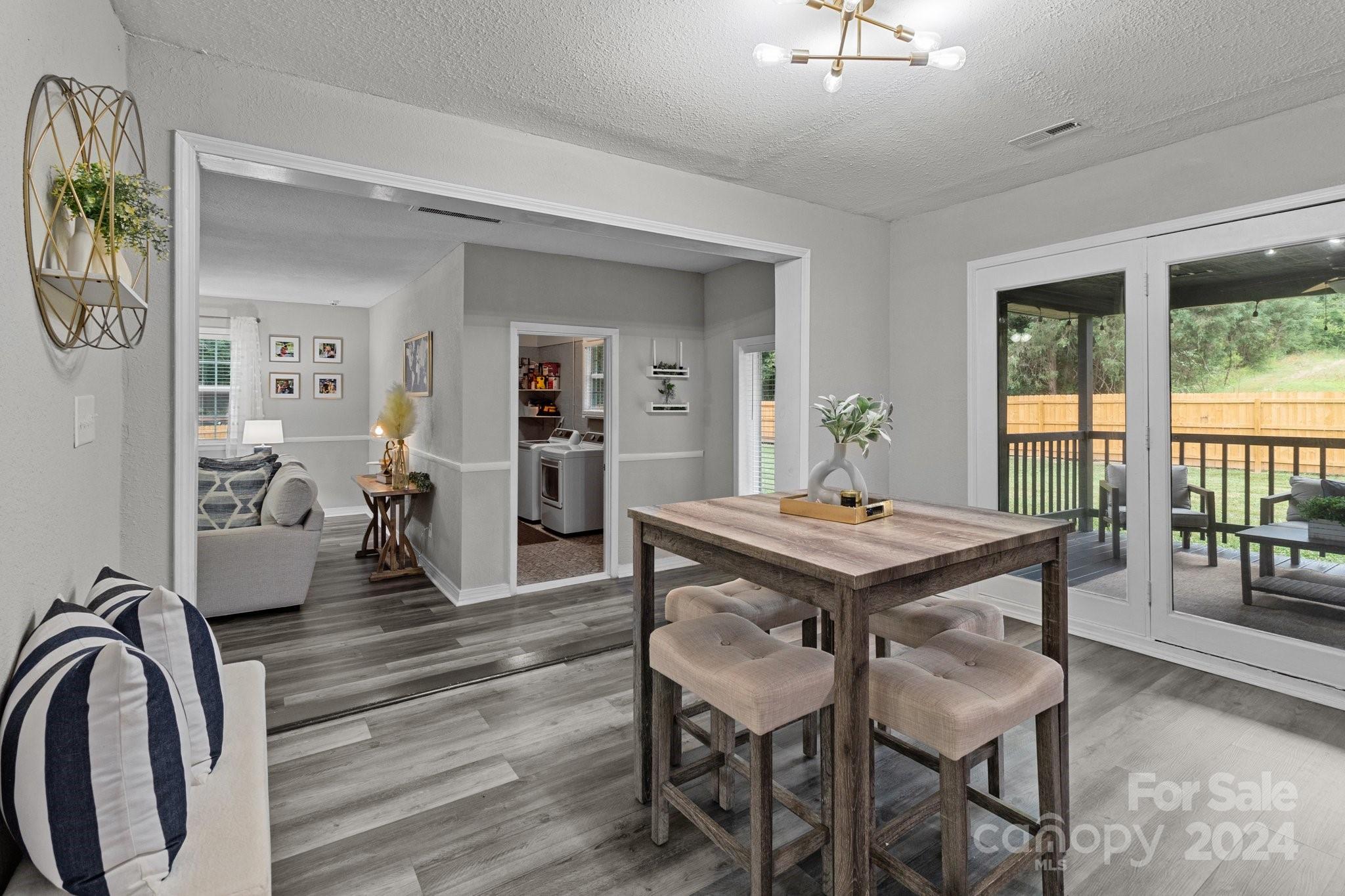 955 Lakeview Road Salisbury, NC 28147 - Photo 15 of 35 a dining room with wooden floor and a table