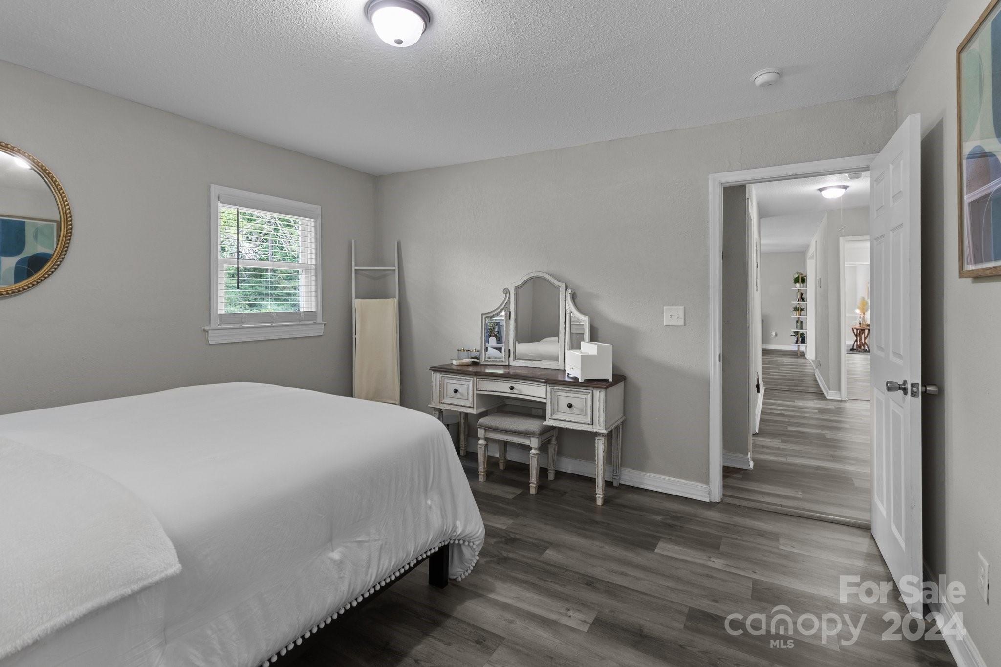 955 Lakeview Road Salisbury, NC 28147 - Photo 27 of 35 a bedroom with a bed and wooden floor