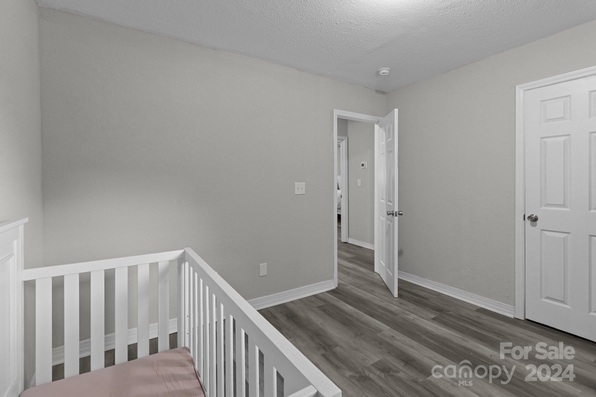 955 Lakeview Road Salisbury, NC 28147 - Photo 29 of 35 a view of a hallway with wooden floor