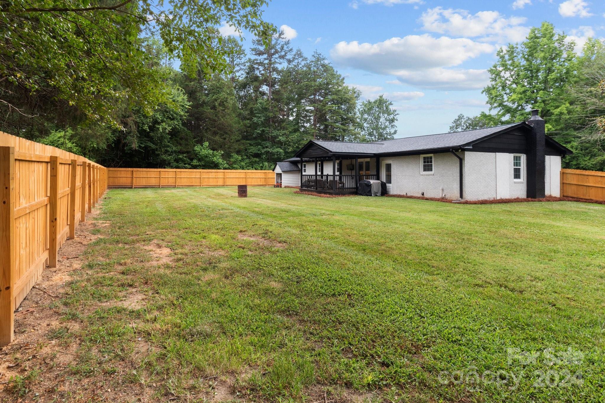 955 Lakeview Road Salisbury, NC 28147 - Photo 33 of 35 a view of a house with a yard and a large tree