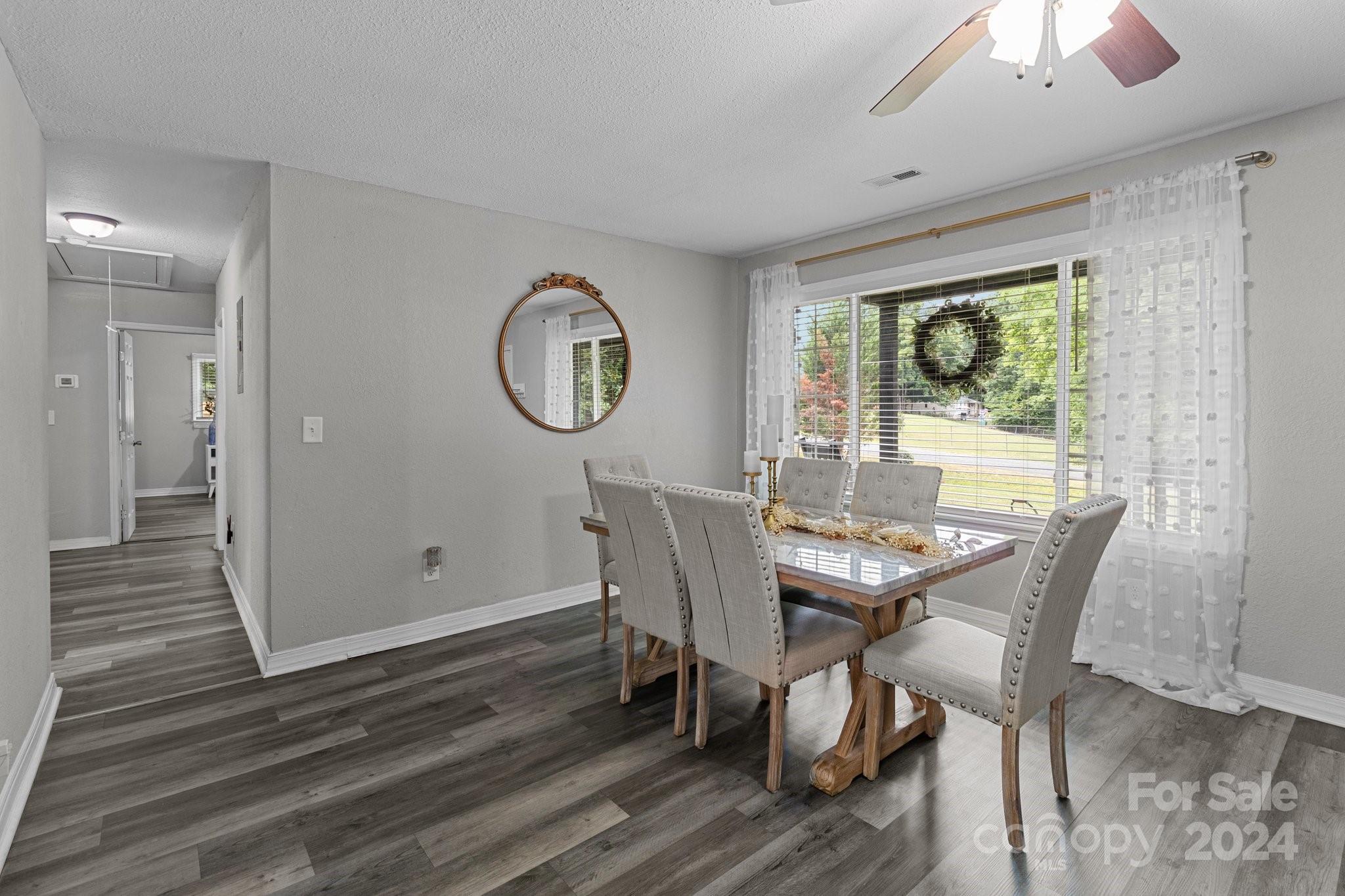 955 Lakeview Road Salisbury, NC 28147 - Photo 5 of 35 a view of a dining room with furniture window and wooden floor