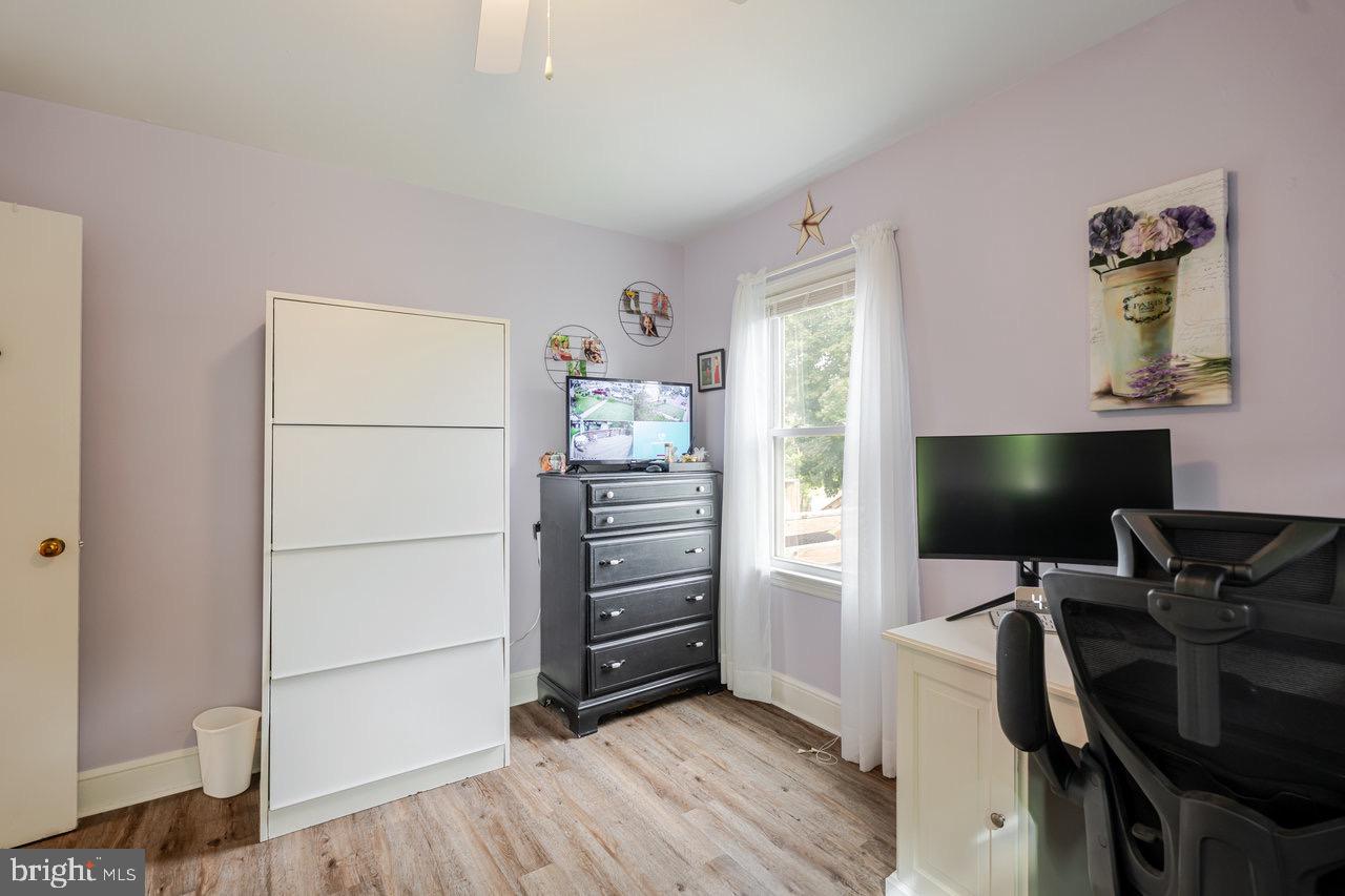 257 Center Street Timberville, VA 22853 - Photo 22 of 73 a view of a workspace with furniture and wooden floor
