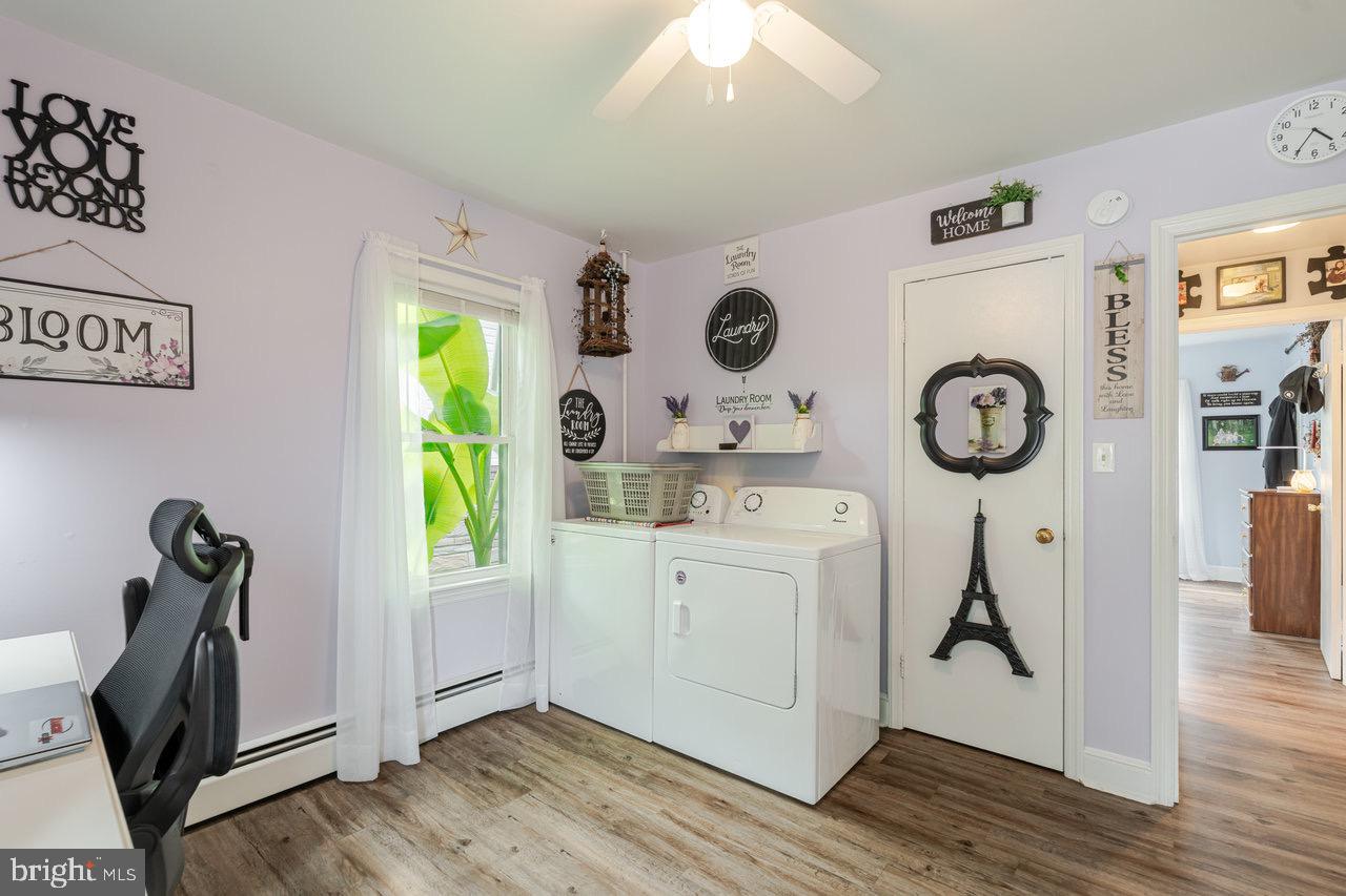 257 Center Street Timberville, VA 22853 - Photo 24 of 73 a view of a kitchen with fridge and wooden floor