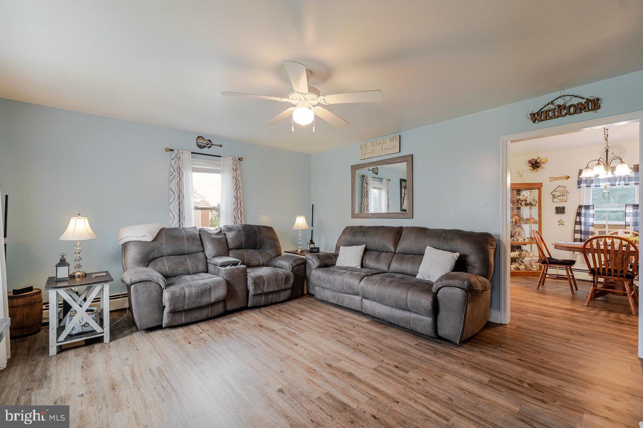 257 Center Street Timberville, VA 22853 - Photo 26 of 73 a living room with furniture and a wooden floor