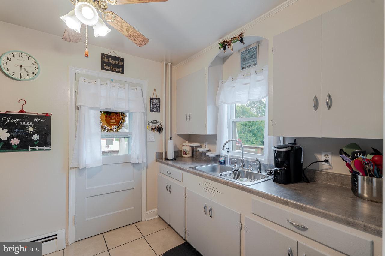 257 Center Street Timberville, VA 22853 - Photo 27 of 73 a kitchen with cabinets and window