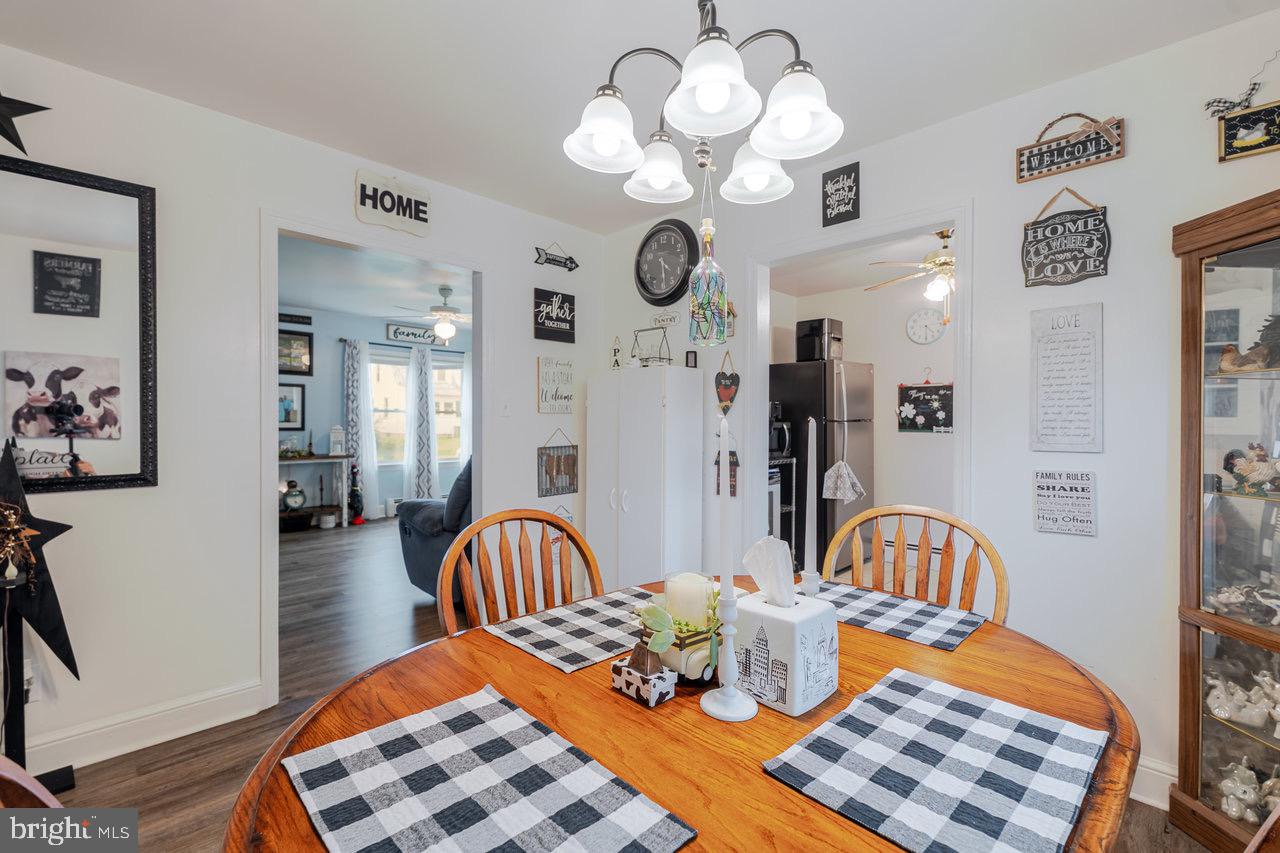 257 Center Street Timberville, VA 22853 - Photo 28 of 73 a bedroom with furniture and wooden floor