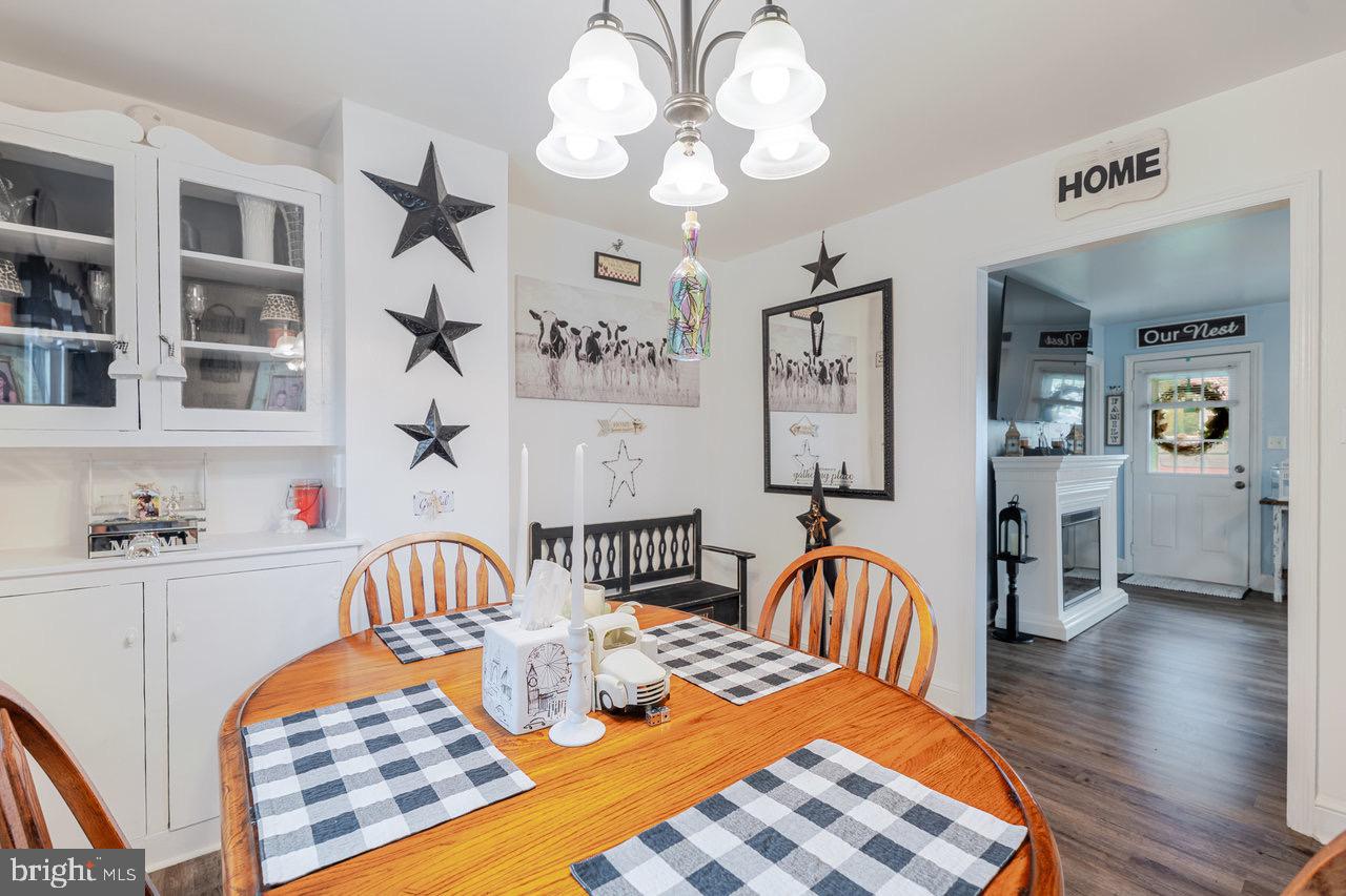 257 Center Street Timberville, VA 22853 - Photo 29 of 73 a view of a dining room with furniture and chandelier