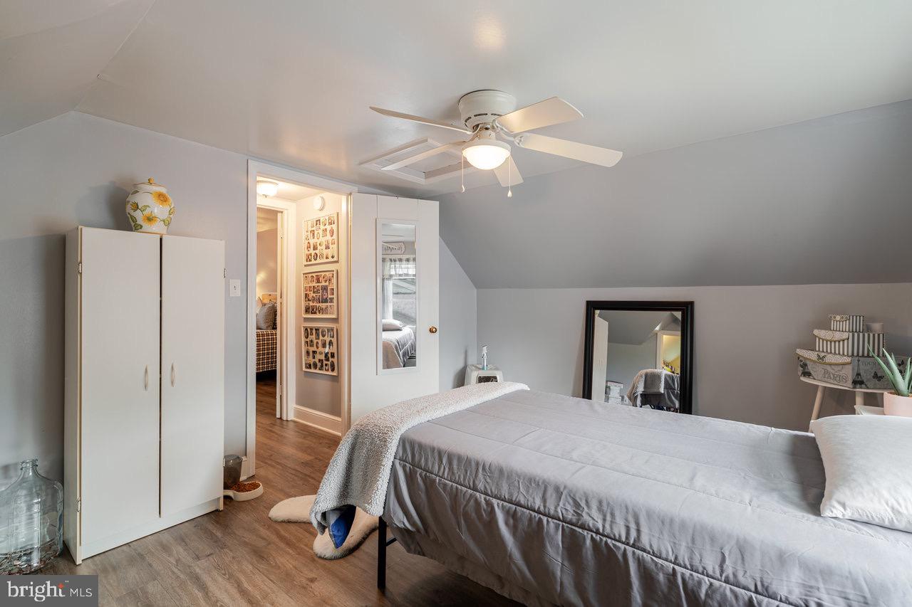 257 Center Street Timberville, VA 22853 - Photo 30 of 73 a bedroom with a bed and wooden floor