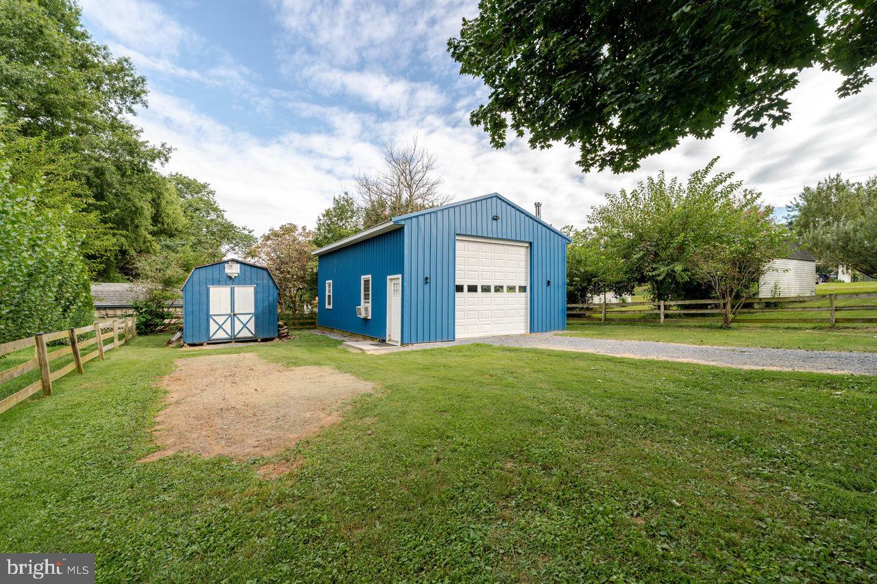 257 Center Street Timberville, VA 22853 - Photo 44 of 73 a front view of a house with a yard and trees