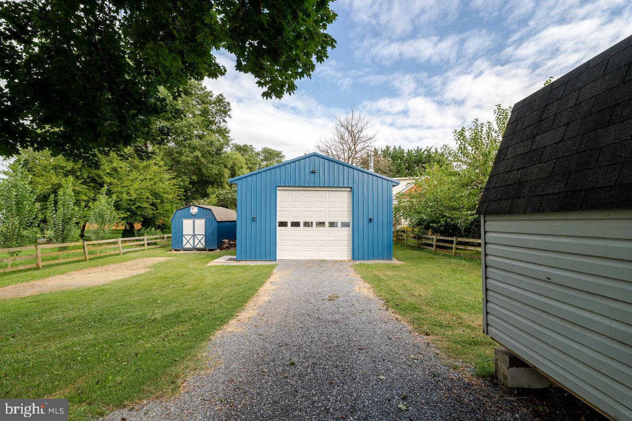 257 Center Street Timberville, VA 22853 - Photo 45 of 73 a front view of a house with a yard and garage