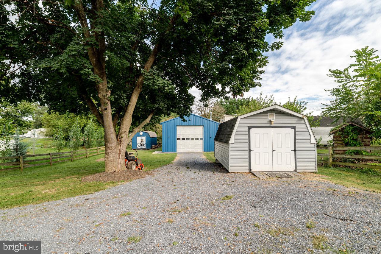 257 Center Street Timberville, VA 22853 - Photo 46 of 73 a view of a house with a yard and large trees