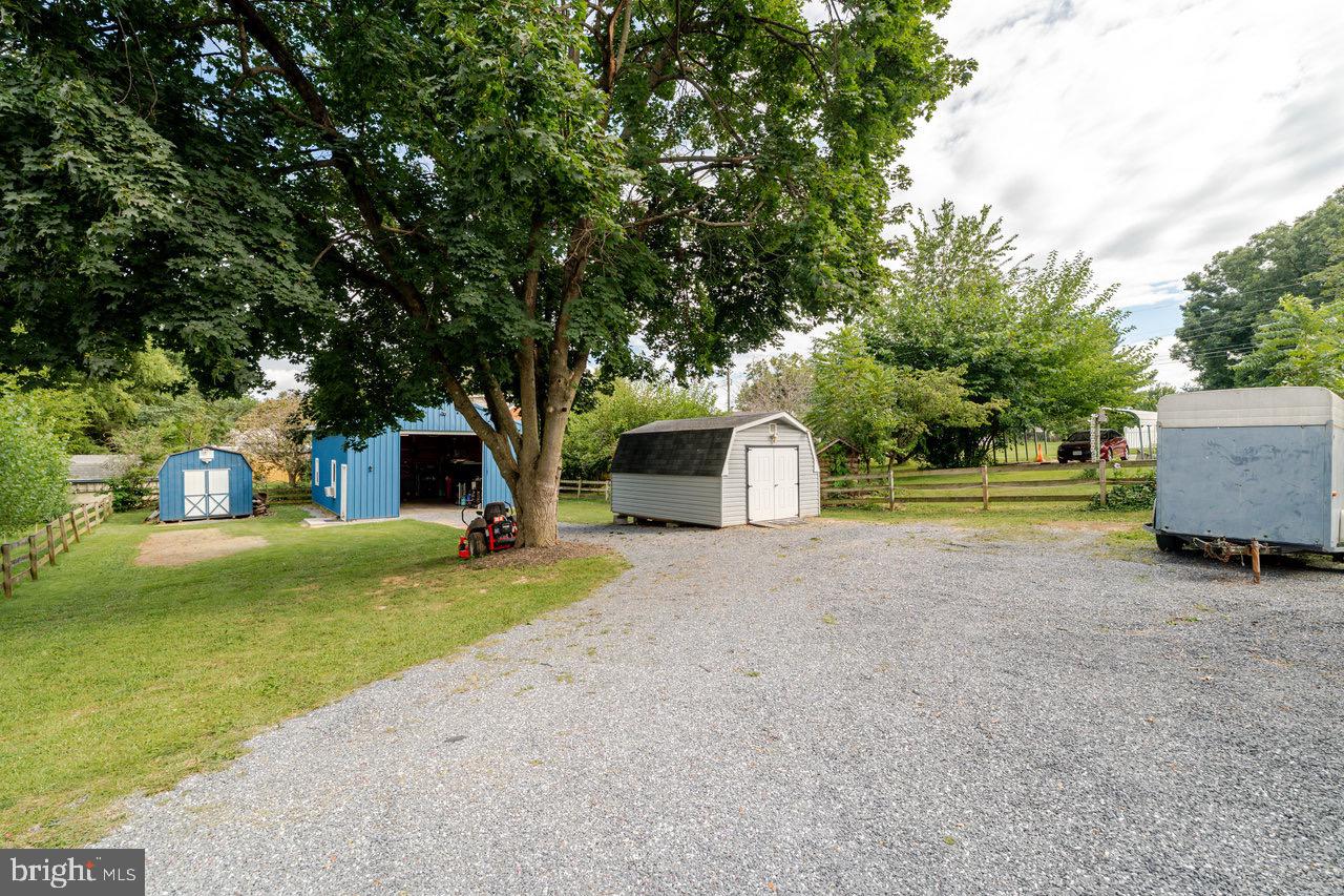 257 Center Street Timberville, VA 22853 - Photo 47 of 73 a front view of a house with a garden and tree