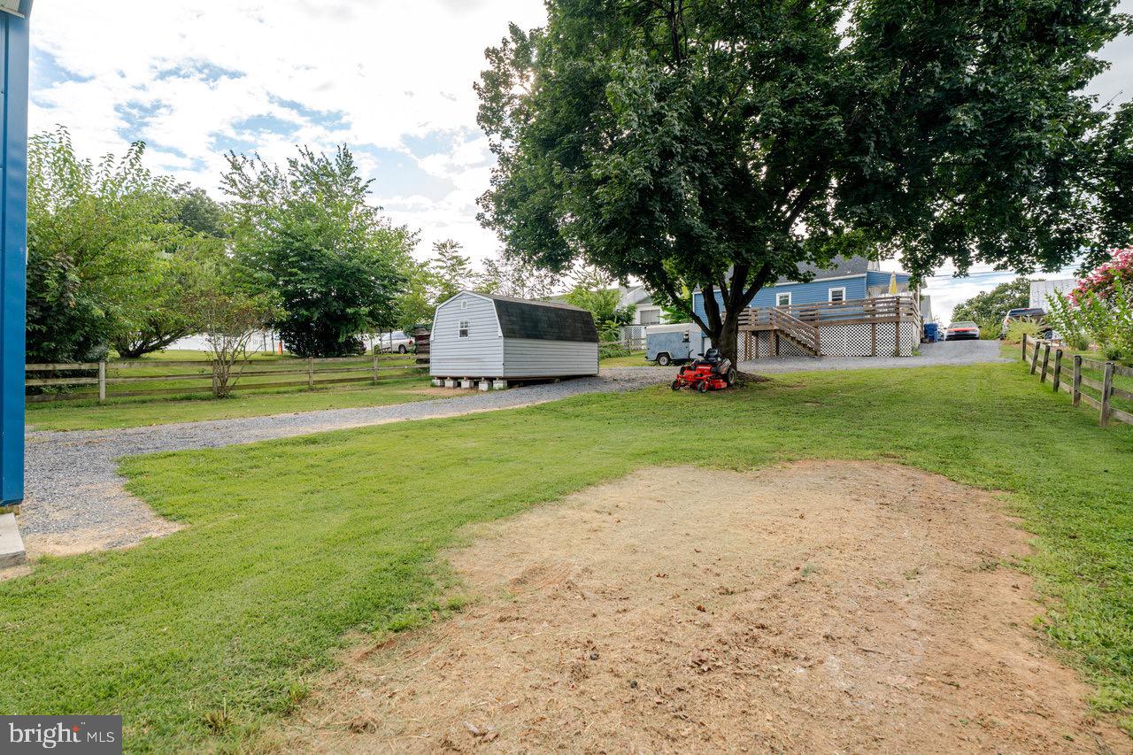 257 Center Street Timberville, VA 22853 - Photo 71 of 73 a view of a house with a big yard and large trees
