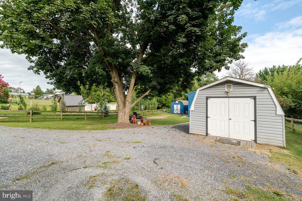 257 Center Street Timberville, VA 22853 - Photo 73 of 73 a view of a house with a yard and large trees