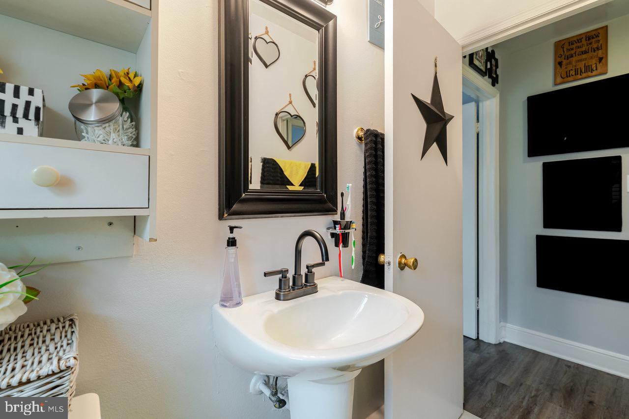 257 Center Street Timberville, VA 22853 - Photo 10 of 73 a bathroom with a sink and a mirror