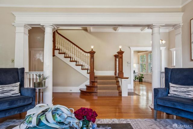 a view of a dining room with furniture window and wooden floor