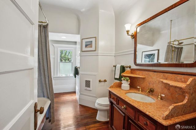 an aerial view of a house with a yard garage and mountain view in back