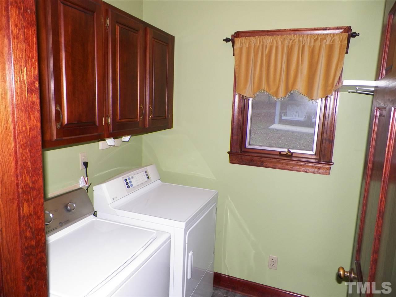 6627 Battle Bridge Road Raleigh, NC 27610 - Photo 11 of 25 a utility room with dryer and washer