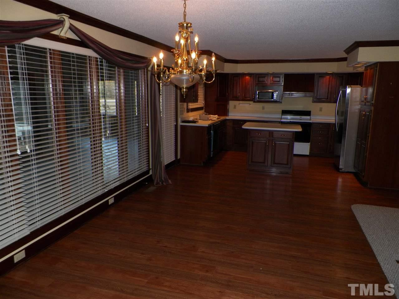 6627 Battle Bridge Road Raleigh, NC 27610 - Photo 12 of 25 a kitchen with refrigerator and window