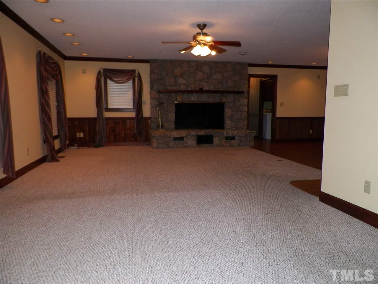 6627 Battle Bridge Road Raleigh, NC 27610 - Photo 13 of 25 a view of a livingroom with a fireplace