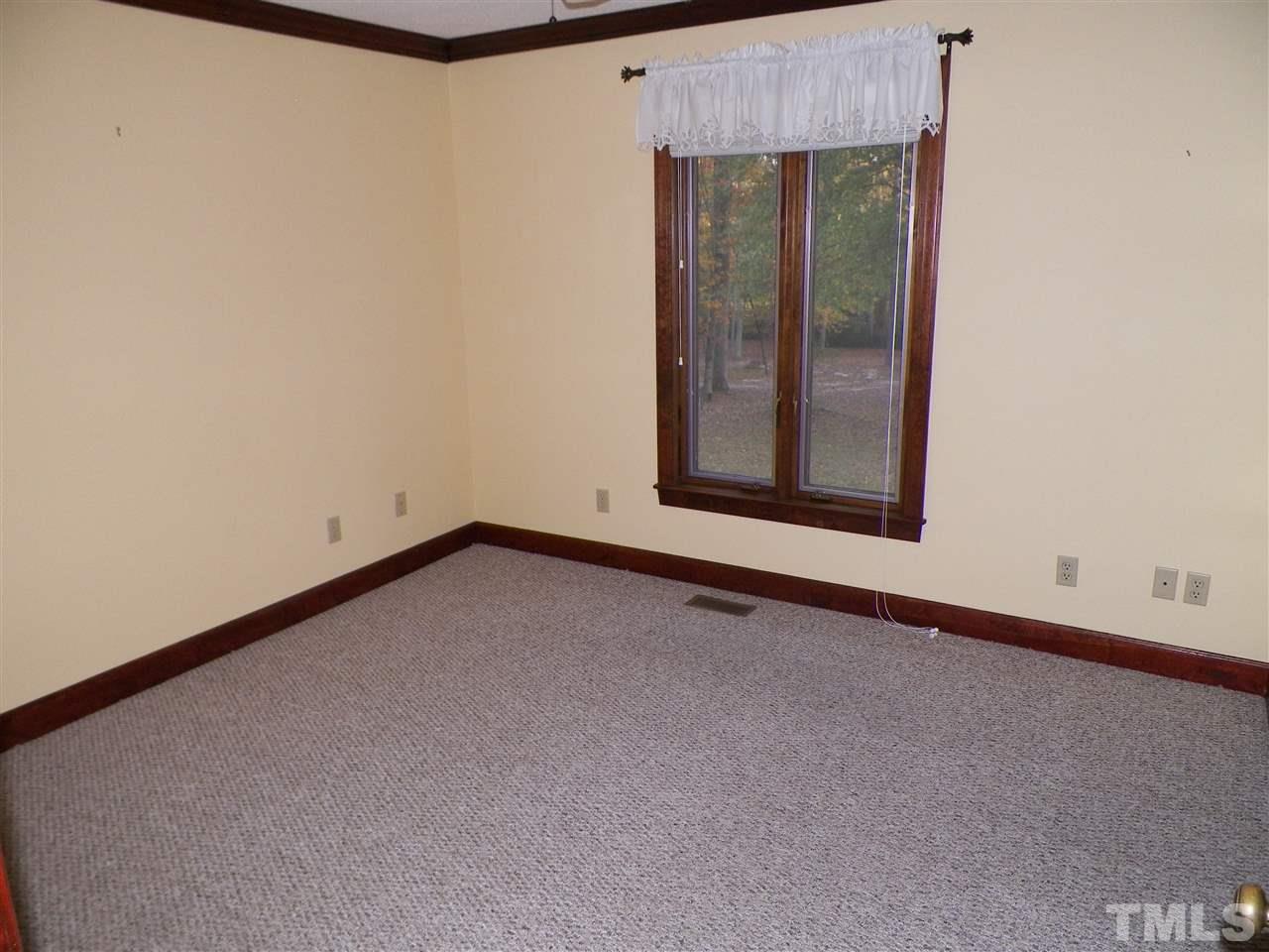 6627 Battle Bridge Road Raleigh, NC 27610 - Photo 20 of 25 a view of an empty room with a window