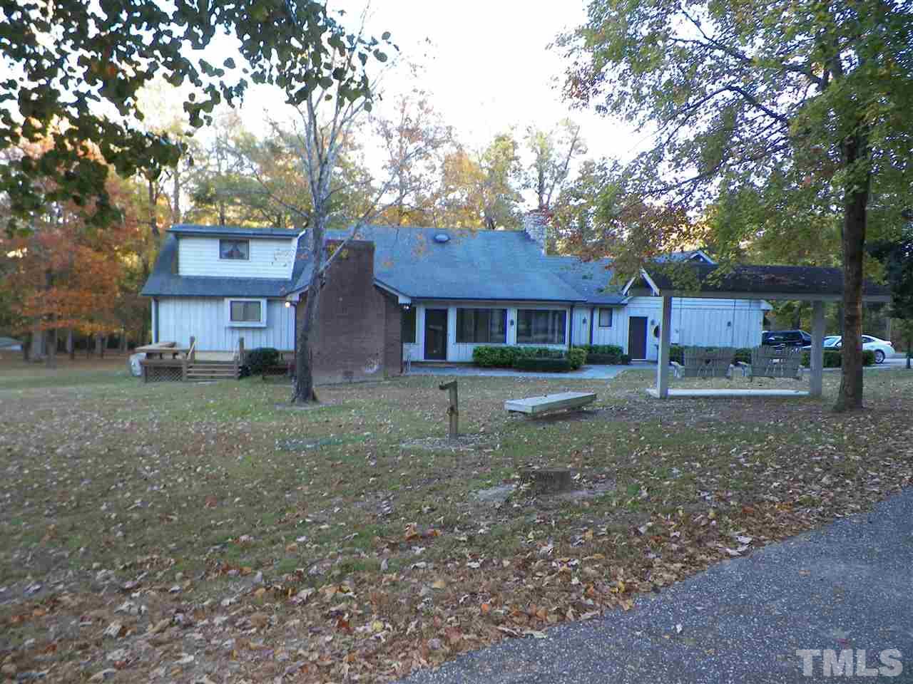 6627 Battle Bridge Road Raleigh, NC 27610 - Photo 4 of 25 a house view with a garden space