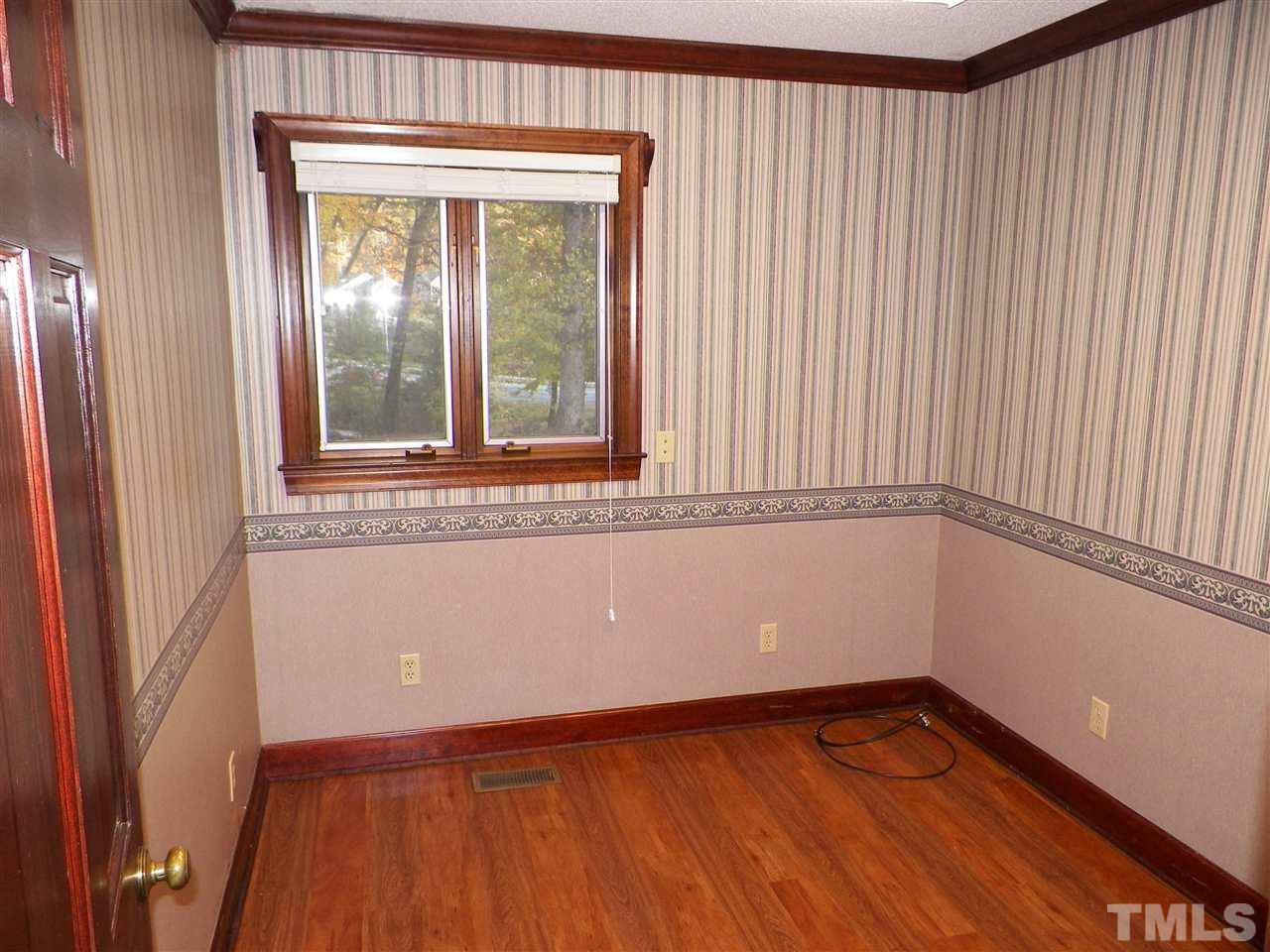 6627 Battle Bridge Road Raleigh, NC 27610 - Photo 9 of 25 a view of a room with wooden floor and a window