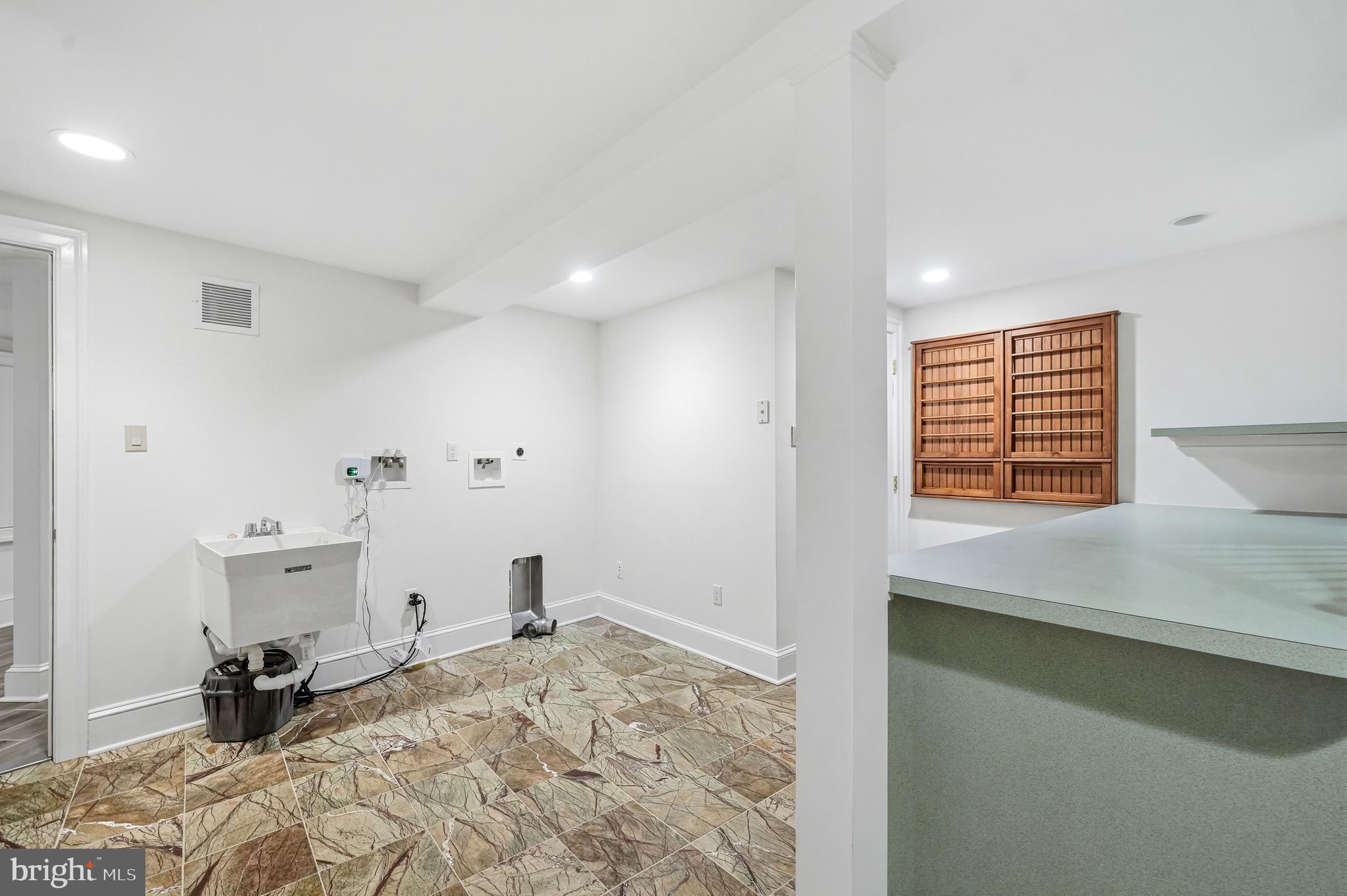 41 Tunbridge Road Haverford, PA 19041 - Photo 80 of 99 lower level laundry room with stairs to mudroom