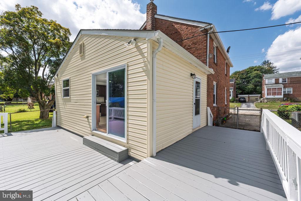 231 East Avon Road Brookhaven, PA 19015 - Photo 30 of 33 a view of a house with a barbeque and wooden stairs
