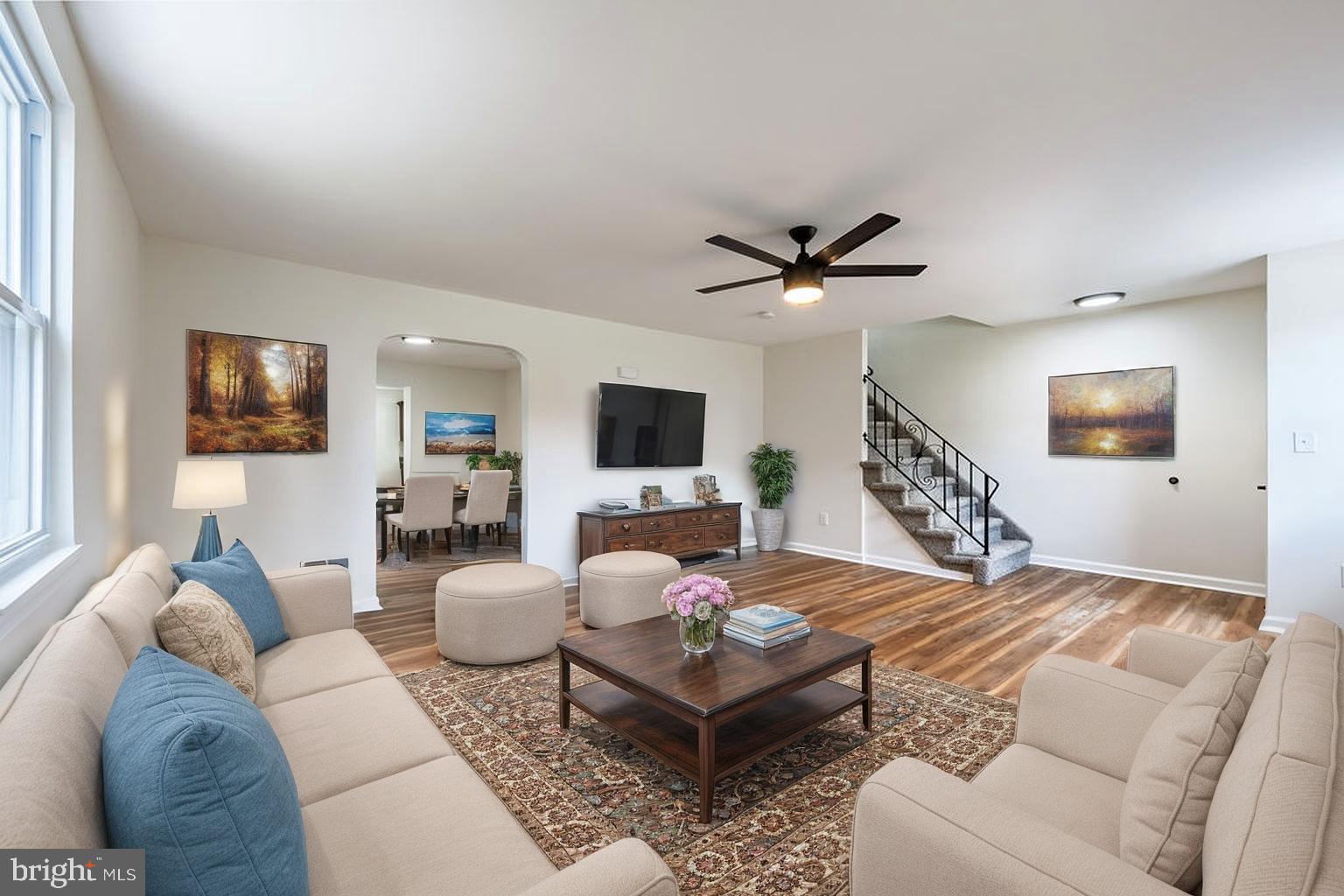 231 East Avon Road Brookhaven, PA 19015 - Photo 4 of 33 a living room with furniture a flat screen tv and a fireplace