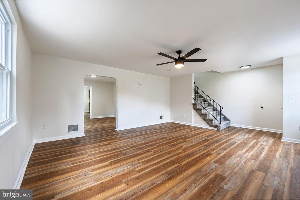 231 East Avon Road Brookhaven, PA 19015 - Photo 5 of 33 wooden floor in an empty room with a window