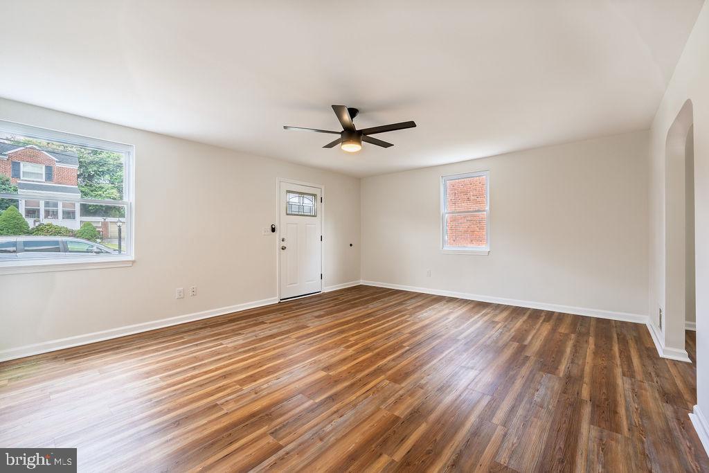 231 East Avon Road Brookhaven, PA 19015 - Photo 6 of 33 an empty room with wooden floor and windows