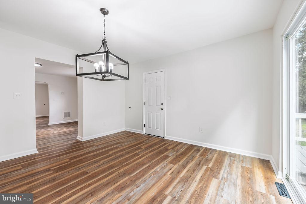 231 East Avon Road Brookhaven, PA 19015 - Photo 10 of 33 a view of empty room with wooden floor and windows