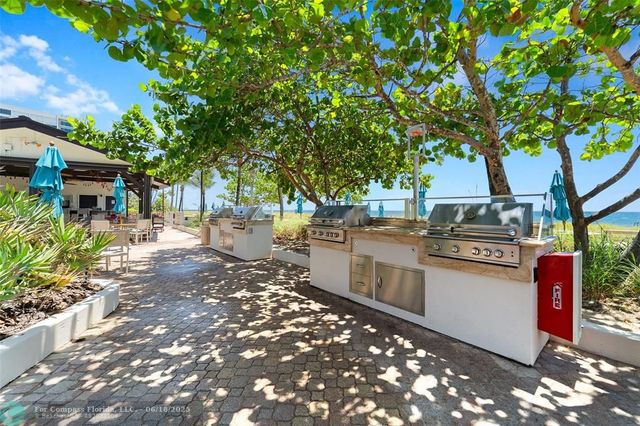 a view of swimming pool with lounge chair
