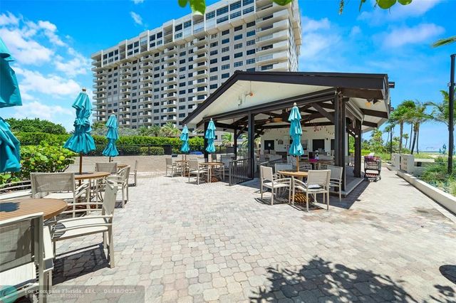 a view of swimming pool from a balcony