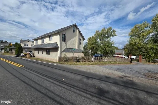 a view of a house with a street