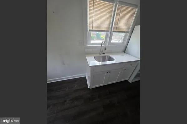 a kitchen with a sink and window