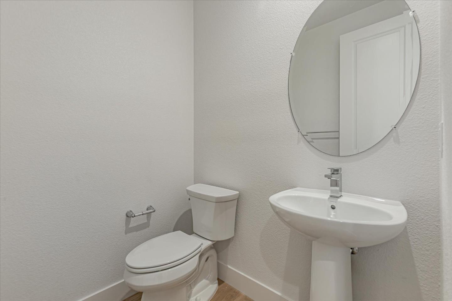 522 Lapis Court San Ramon, CA 94583 - Photo 12 of 23 a bathroom with a toilet a sink and a mirror