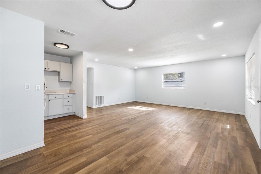 1132 Auburn Street Clearwater, FL 33756 - Photo 6 of 9 a view of empty room with wooden floor