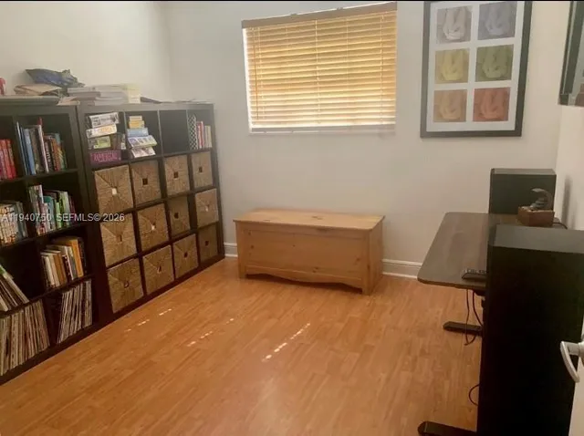 a view of a bedroom with workspace