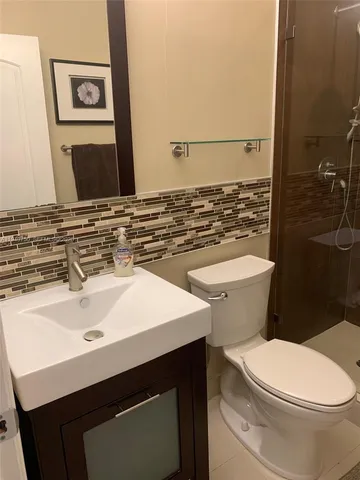 a bathroom with a sink and a toilet
