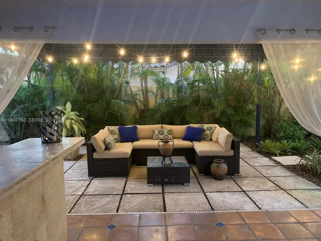 a outdoor living space with furniture and garden view