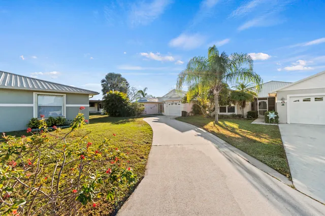 a large tree in front of a house