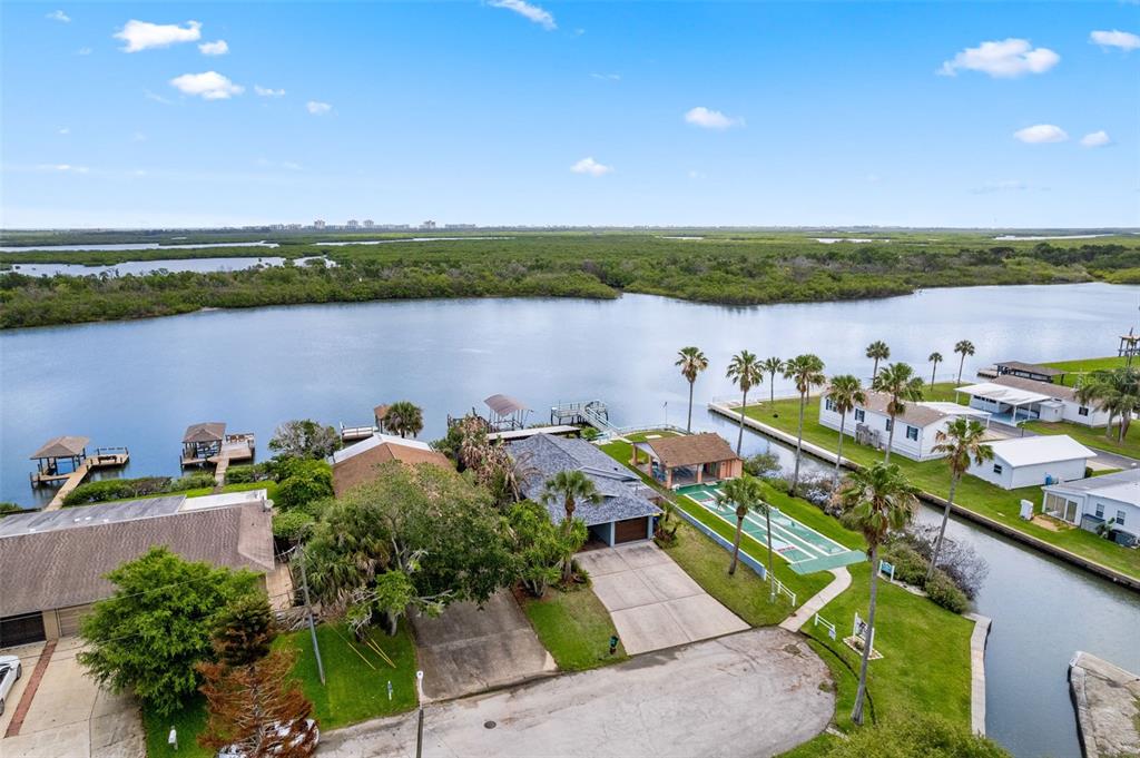 29 Pelican Lane Edgewater, FL 32141 - Photo 31 of 39 an aerial view of a house with a yard and lake view