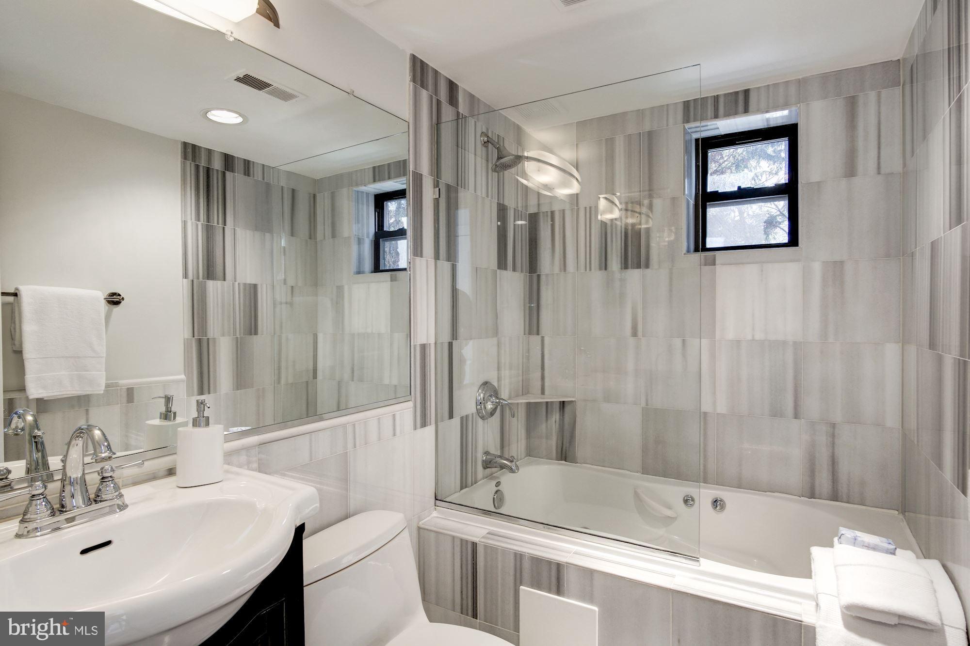 1354 Euclid Street Northwest, Unit 201B Washington, DC 20009 - Photo 19 of 30 Turkish marble en-suite bath w/soaking tub