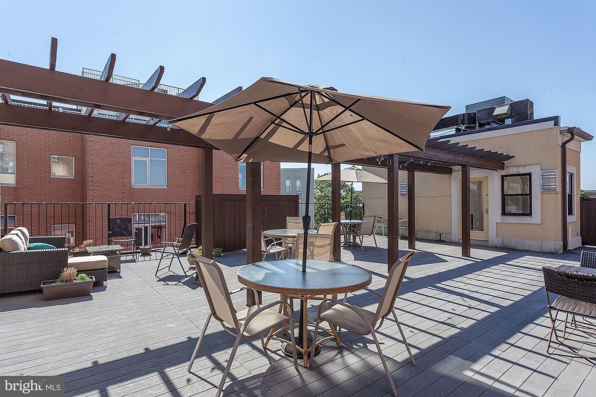 1354 Euclid Street Northwest, Unit 201B Washington, DC 20009 - Photo 29 of 30 Dine al fresco on the rooftop lounge