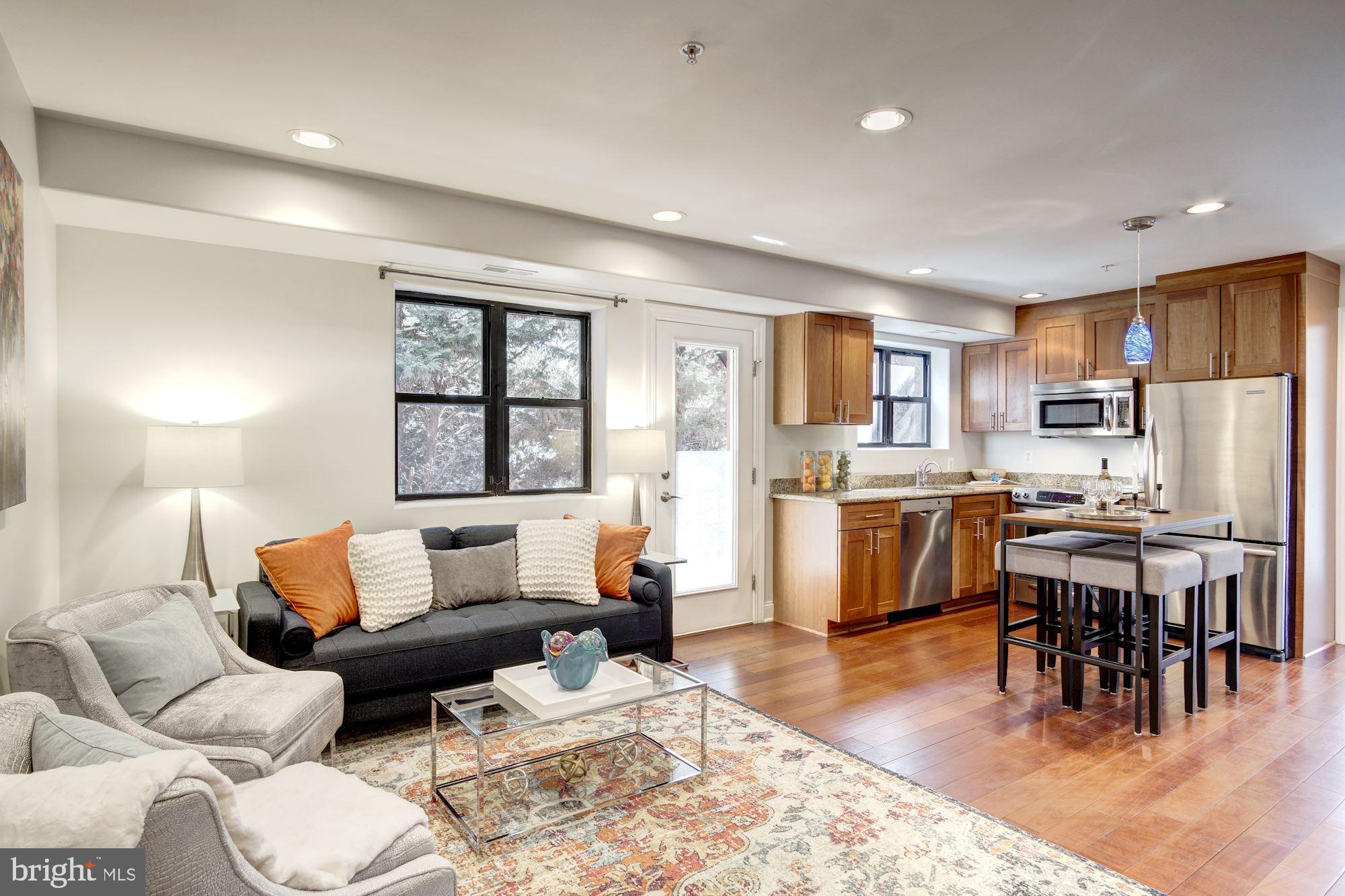 1354 Euclid Street Northwest, Unit 201B Washington, DC 20009 - Photo 4 of 30 Bright open living, dining, & kitchen