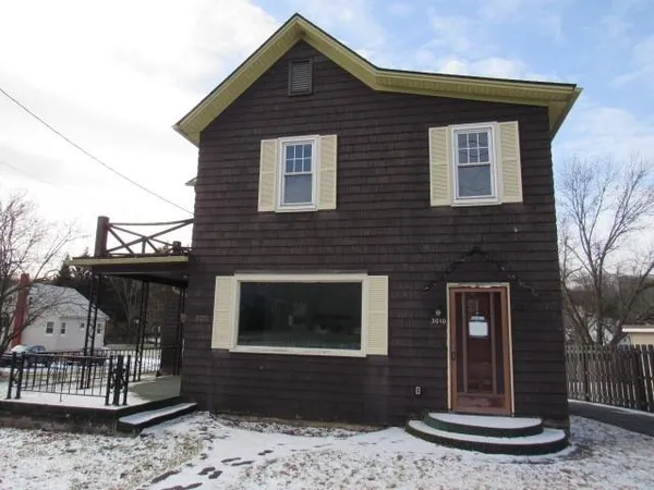 a front view of a house with entertaining space