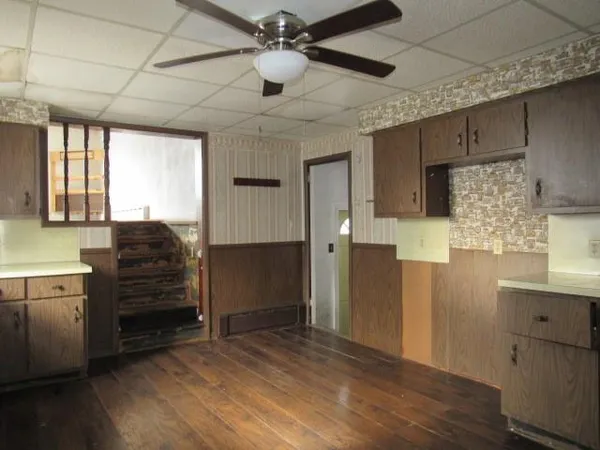 a bathroom with a refrigerator and a sink