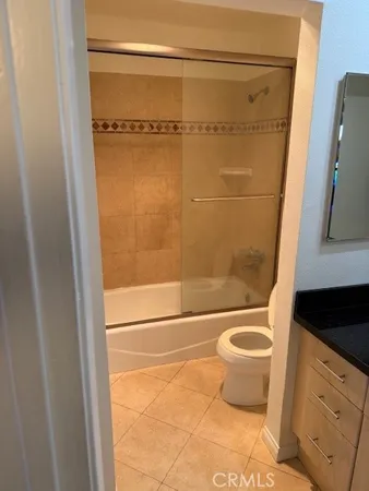 a bathroom with a shower and a toilet